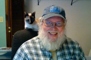 Photo of Don Taylor with cat Nasi.