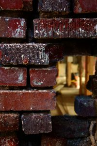 photo of hole in a brick wall