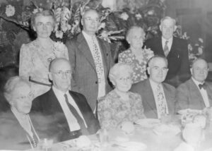 Photo of 9 Baptist that includes Rev. & Mrs William Towart, Rev. & Mrs Joseph Robbine, Artemis and Ethel Sweezey, Dr. Ferdinand Peterson, and Mr. & Mrs. Clarence Mitchell.