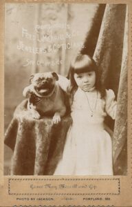 Photo of Grace May Merrill and her Pug, "Gip", circa 1893.