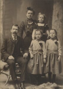 Photo of James & Mary (Swasey) & Florence, Lillie, & Mattie Cary, circa 1903.