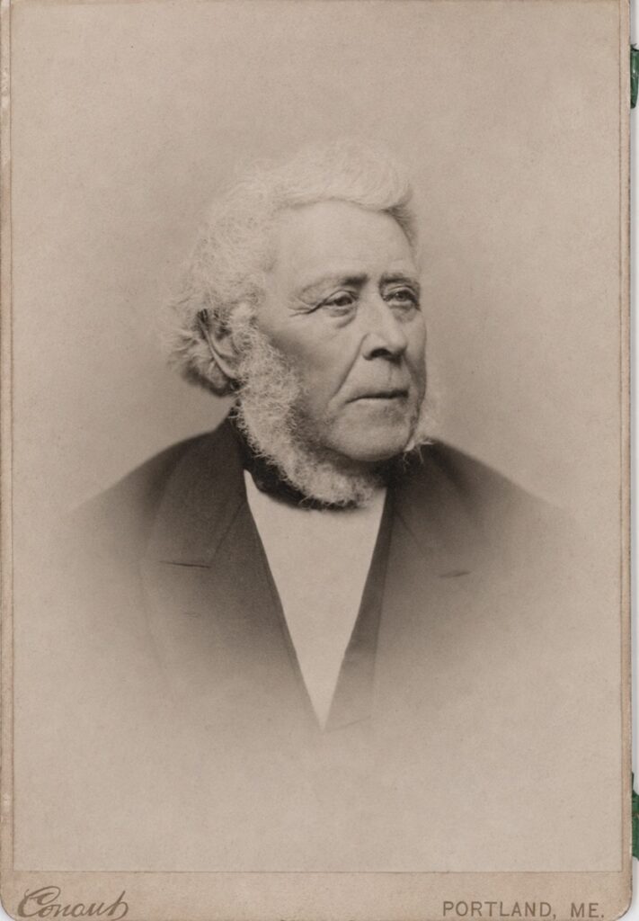 Cabinet card bust portrait of an elderly white-haired man with a beard, photographer Conaut, Portland, Maine, circa 1876–1891.