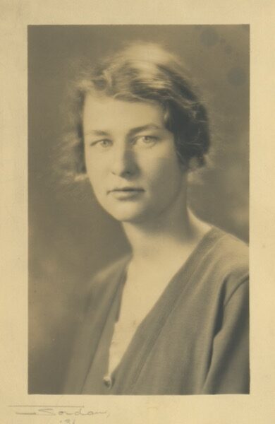Sepia-toned studio graduation portrait of Margaret Kinney, age approximately 19 to 20, photographed by Jordan Studio in 1931.