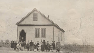 Children_and_adults_in_front_of_a_school_building_in_rural_Baldwin_County_Alabama.jpg From Alabama Superintendent of Education photograph album, LPP16, Alabama Dept. of Archives and History. via ADAH https://digital.archives.alabama.gov/cdm/singleitem/collection/photo/id/18058/rec/1