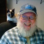 Photo of Don Taylor with cat Nasi.