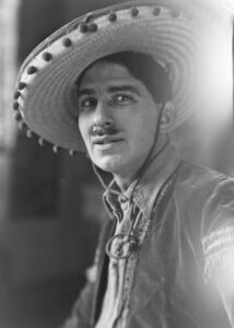 Photo of a mustashed man in a mexican hat. 