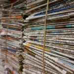 Photo of stacks of newspapers - via Pixabay.