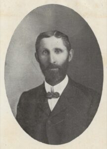 Photo of a man with a full beard, circa 1903.