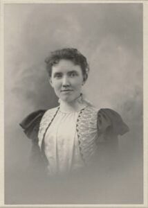 Photo of a young woman, about 18 years old. Clothing suggests about 1900.