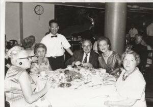 Photo of five people having dinner at a restaurant.