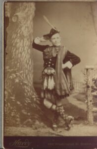 Photo of a teenager in a Scottish costume.