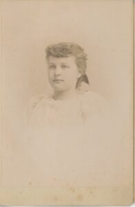 Cabinet card photo of a young woman.