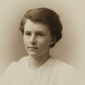 A studio portrait of a young woman in her late teens or early 20s.