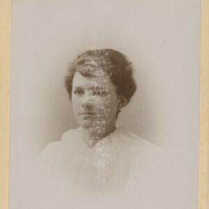 A studio portrait of a young woman in her late teens or early 20s.