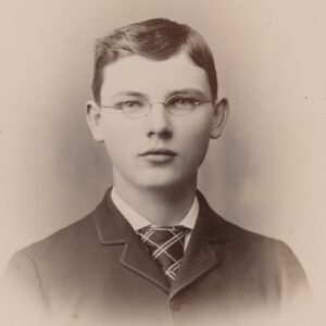 A photo of a young man in his late teens or early twenties.