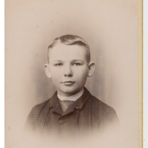 A photograph of a young man in his early teens, likely around 12 to 14.