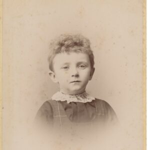 A photograph of a young girl, likely a preteen. 