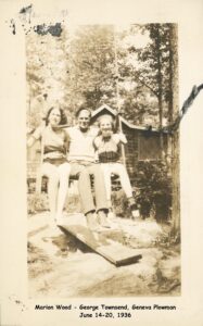 Three young people on a rope swing.