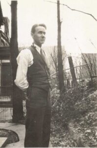 Frank Lane standing outside. 