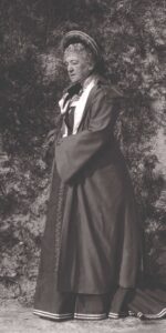 Photo of Louise Kinney standing, circa 1907.